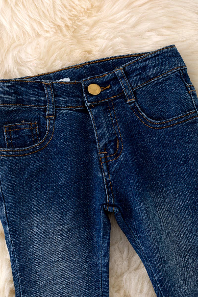 Dark blue denim w/ embroidered pocket.